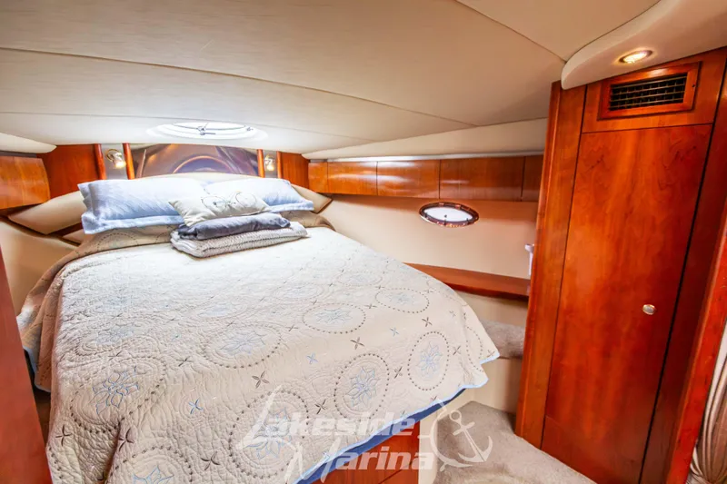 Slide: The Image of Luxurious cabin interior of 2006 Cruisers Yachts 420 Express with cozy bedding. - 114