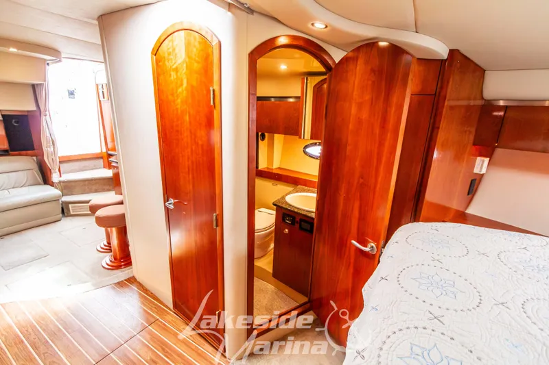 Slide: The Image of Luxurious 2006 Cruisers Yachts 420 Express interior with wood finish and cozy seating area. - 115