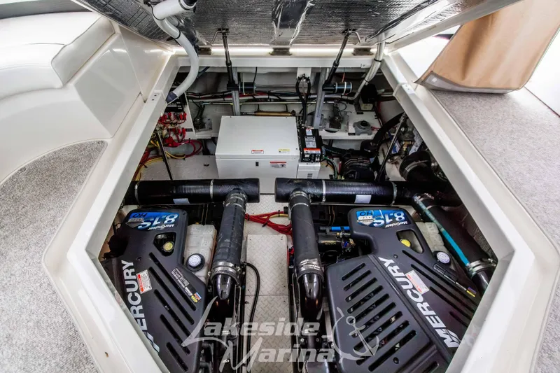 Slide: The Image of Engine compartment of 2006 Cruisers Yachts 420 Express with Mercury engines. - 124