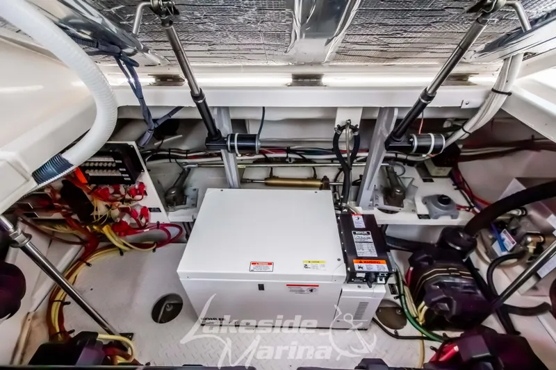 Slide: The Image of Engine room of 2006 Cruisers Yachts 420 Express with mechanical components and wiring. - 125