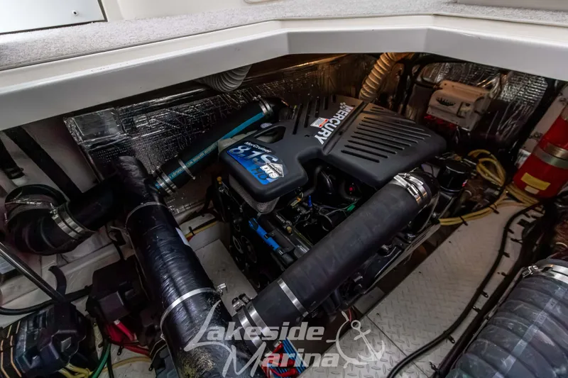 Slide: The Image of Engine room of 2006 Cruisers Yachts 420 Express with Mercury engine components. - 127