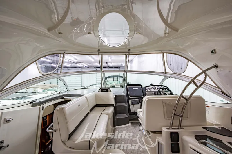 Slide: The Image of Interior of 2006 Cruisers Yachts 420 Express, featuring luxurious seating and modern helm controls. - 130