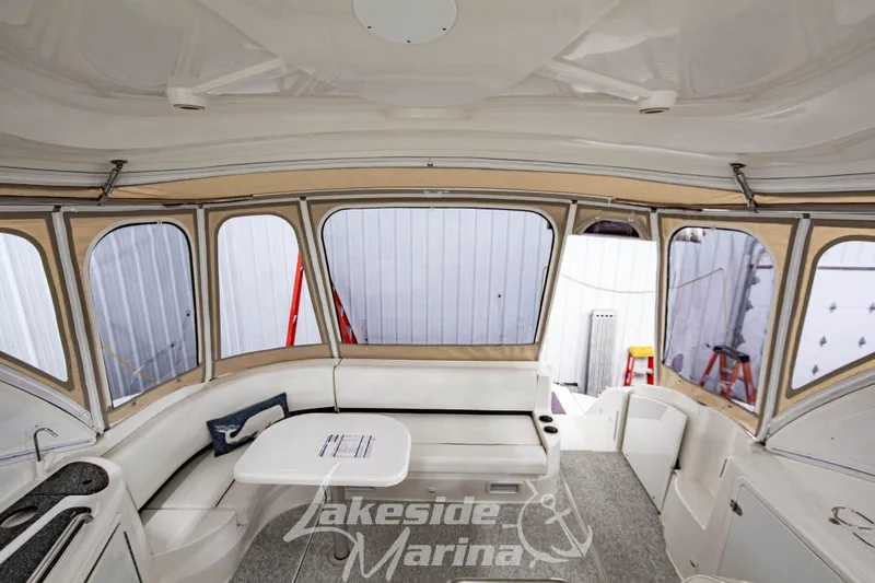 Slide: The Image of 2006 Cruisers Yachts 420 Express interior with seating and table, Lakeside Marina branding. - 131