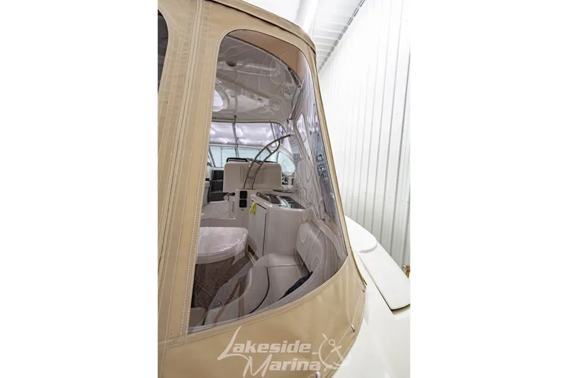 Slide: The Image of 2006 Cruisers Yachts 420 Express interior view with beige canopy and seating. - 133