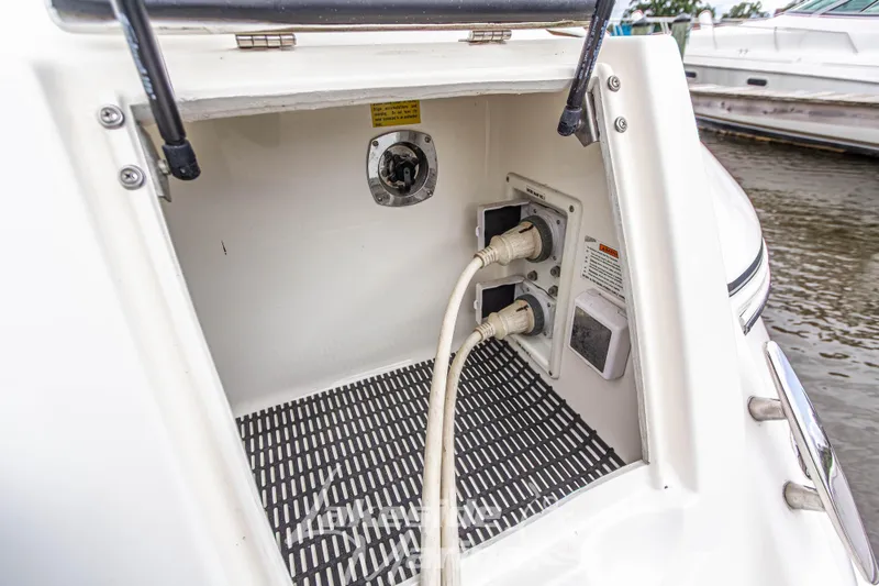 Slide: The Image of Electrical connections on a 2006 Cruisers Yachts 420 Express, docked by the water. - 25