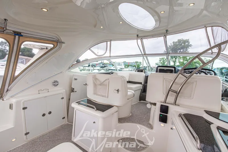 Slide: The Image of 2006 Cruisers Yachts 420 Express interior with seating and helm, Lakeside Marina. - 38