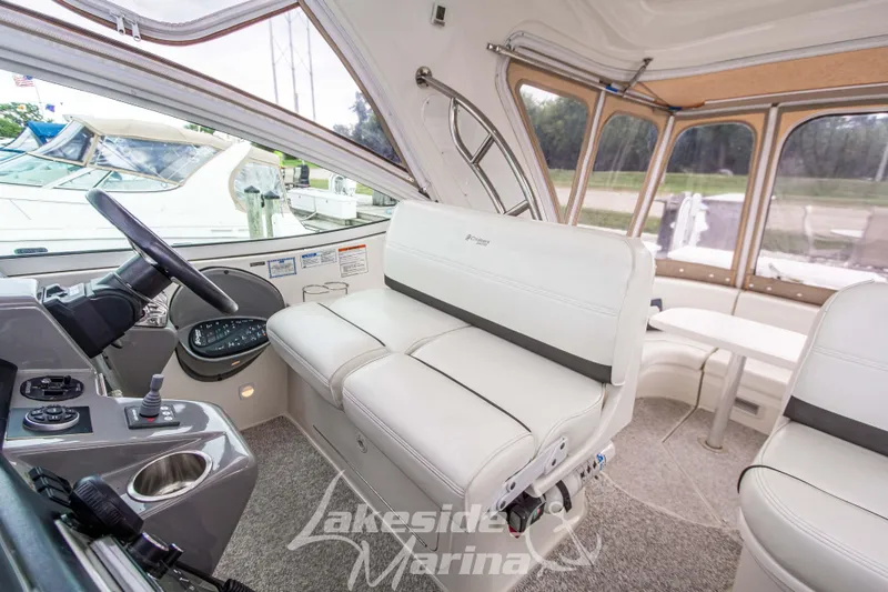 Slide: The Image of Interior of 2006 Cruisers Yachts 420 Express with helm and seating area. - 42