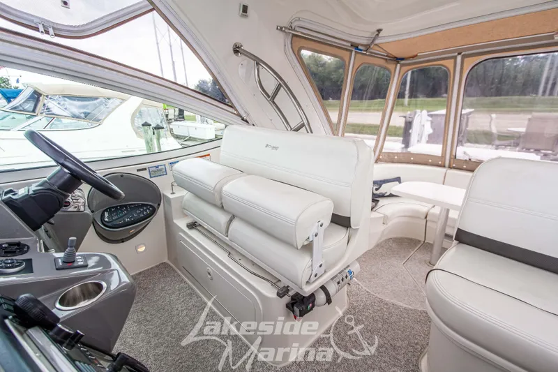 Slide: The Image of 2006 Cruisers Yachts 420 Express interior with helm and seating area. - 43