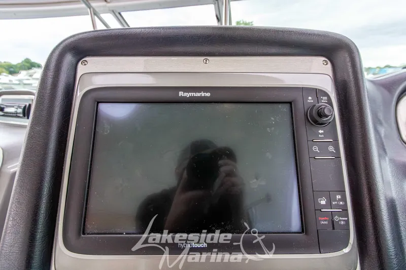 Slide: The Image of Raymarine touchscreen on 2006 Cruisers Yachts 420 Express dashboard at Lakeside Marina. - 47