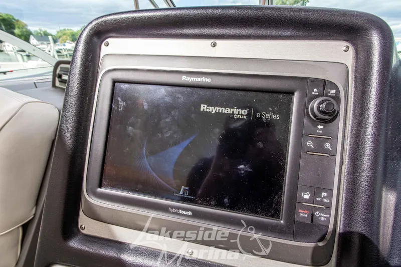 Slide: The Image of Raymarine eSeries navigation system on 2006 Cruisers Yachts 420 Express dashboard. - 55