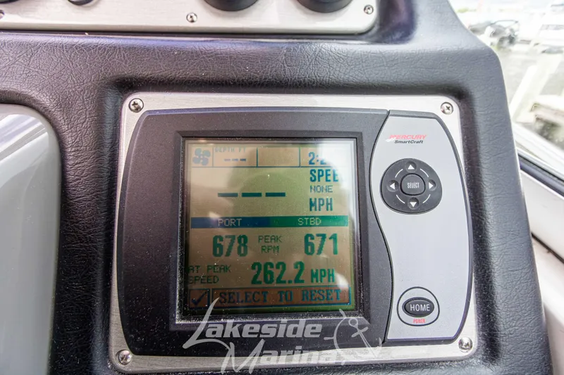 Slide: The Image of Mercury SmartCraft display on 2006 Cruisers Yachts 420 Express dashboard showing speed and RPM. - 56