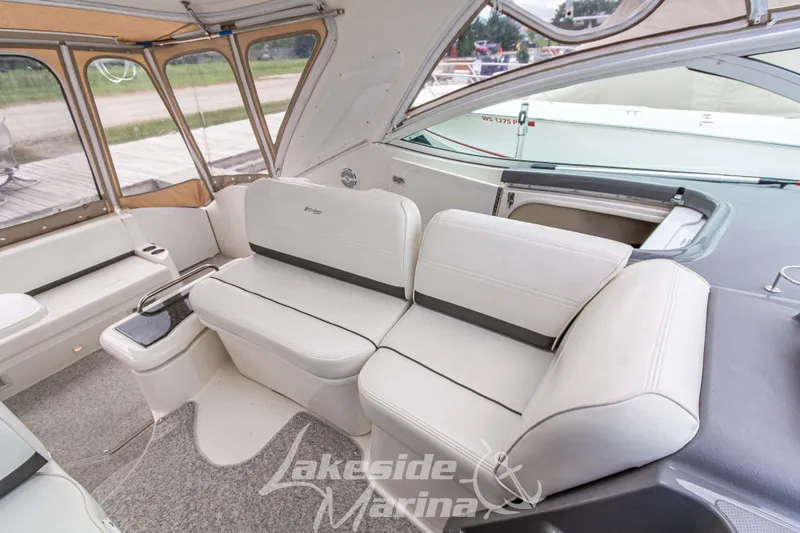 Slide: The Image of Interior of 2006 Cruisers Yachts 420 Express with white seating and carpeted flooring. - 59
