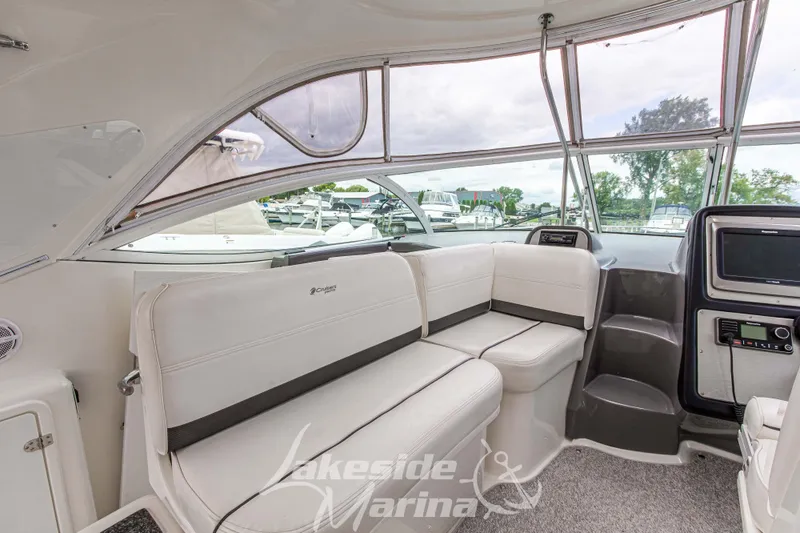 Slide: The Image of 2006 Cruisers Yachts 420 Express interior with white seating and panoramic windows. - 61