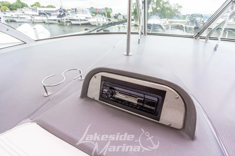 Slide: The Image of 2006 Cruisers Yachts 420 Express dashboard with Sony stereo at Lakeside Marina. - 64