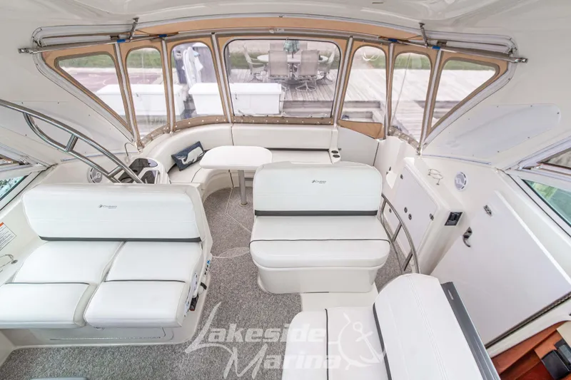 Slide: The Image of Luxurious interior of 2006 Cruisers Yachts 420 Express with white seating and table. - 67