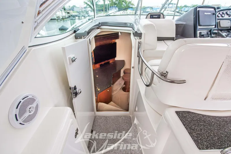 Slide: The Image of 2006 Cruisers Yachts 420 Express interior cabin view with open door and seating area. - 69
