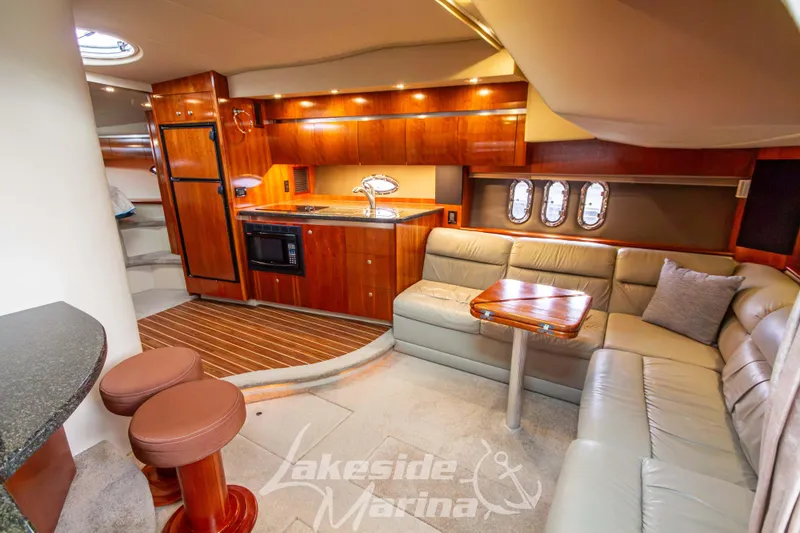 Slide: The Image of Luxurious 2006 Cruisers Yachts 420 Express interior with elegant wood finishes and cozy seating. - 71