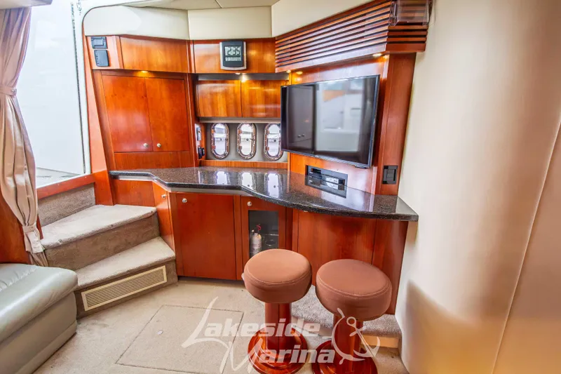 Slide: The Image of Luxurious 2006 Cruisers Yachts 420 Express interior with wood cabinetry and modern amenities. - 73
