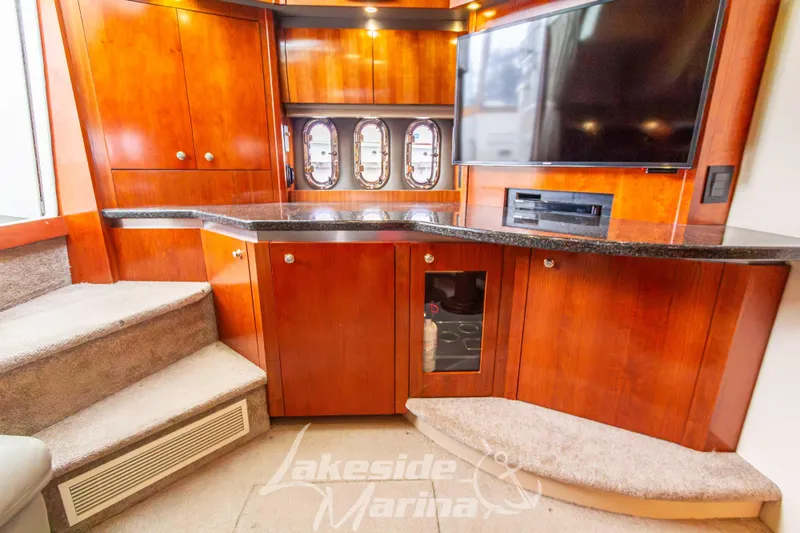 Slide: The Image of Luxurious interior of 2006 Cruisers Yachts 420 Express with wood cabinetry and entertainment system. - 78