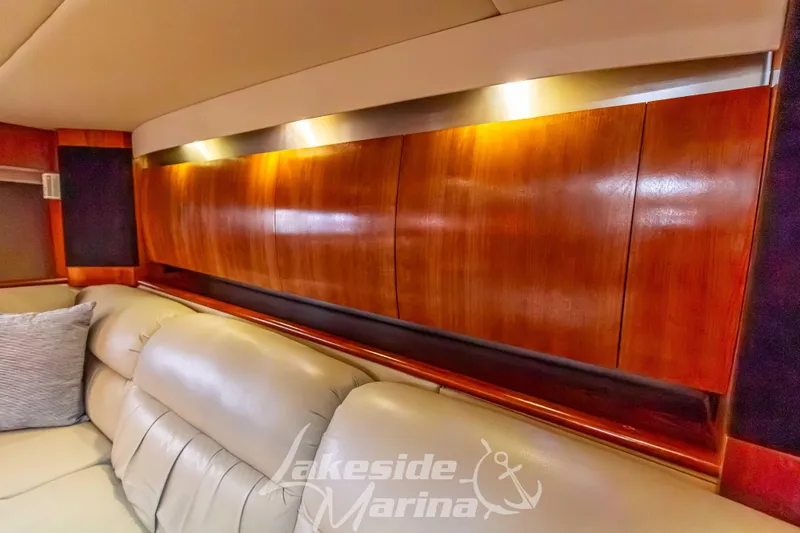 Slide: The Image of Luxurious interior of 2006 Cruisers Yachts 420 Express with elegant wood paneling and plush seating. - 83