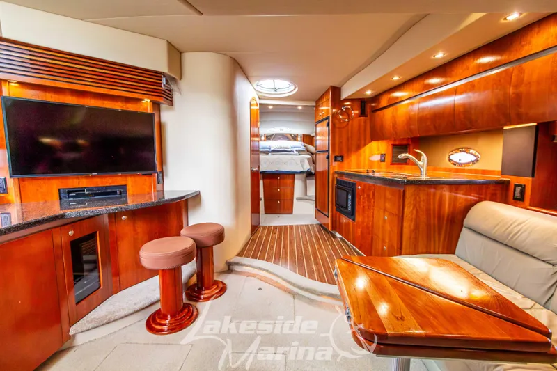 Slide: The Image of Luxurious interior of 2006 Cruisers Yachts 420 Express with wood finishes and modern amenities. - 85