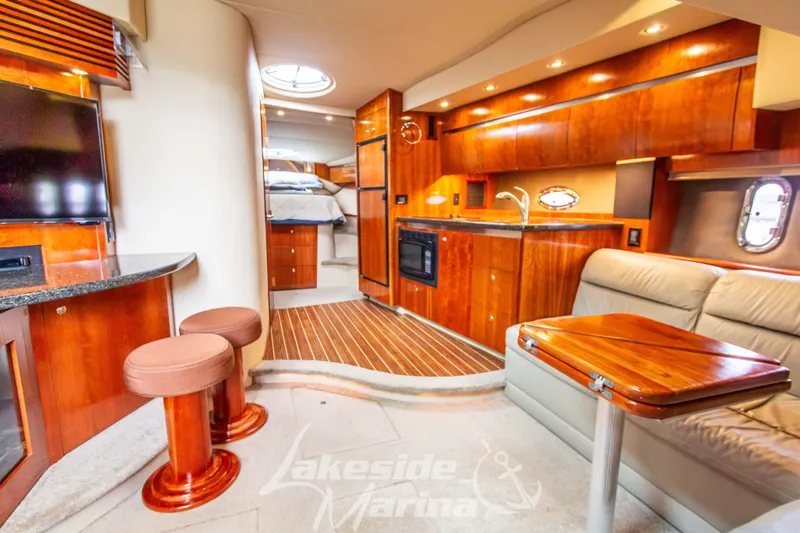 Slide: The Image of Luxurious interior of 2006 Cruisers Yachts 420 Express with wood finishes and modern amenities. - 86