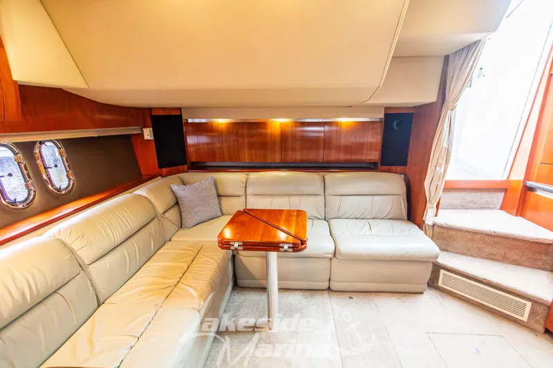 Slide: The Image of Luxurious interior of 2006 Cruisers Yachts 420 Express with leather seating and wooden accents. - 87
