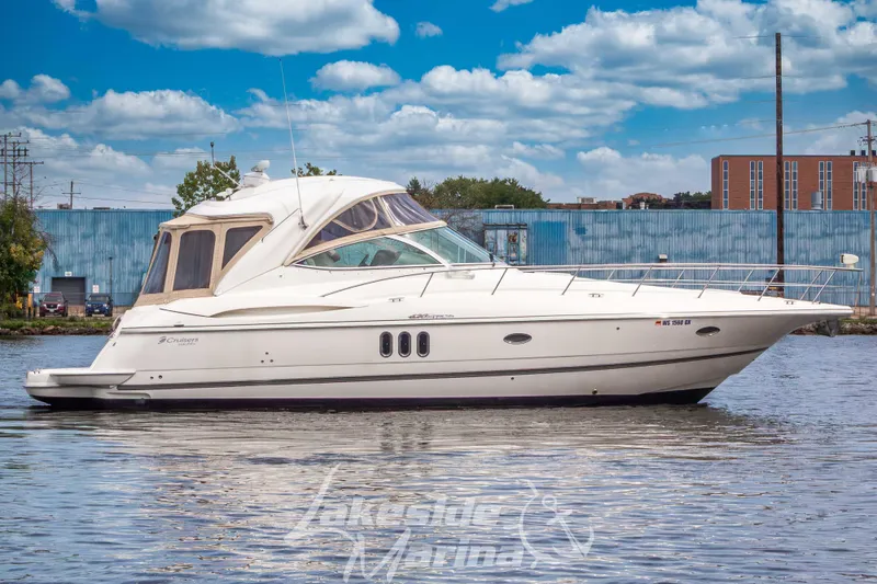 Slide: The Image of 2006 Cruisers Yachts 420 Express on water, showcasing sleek design and luxury features. - 9