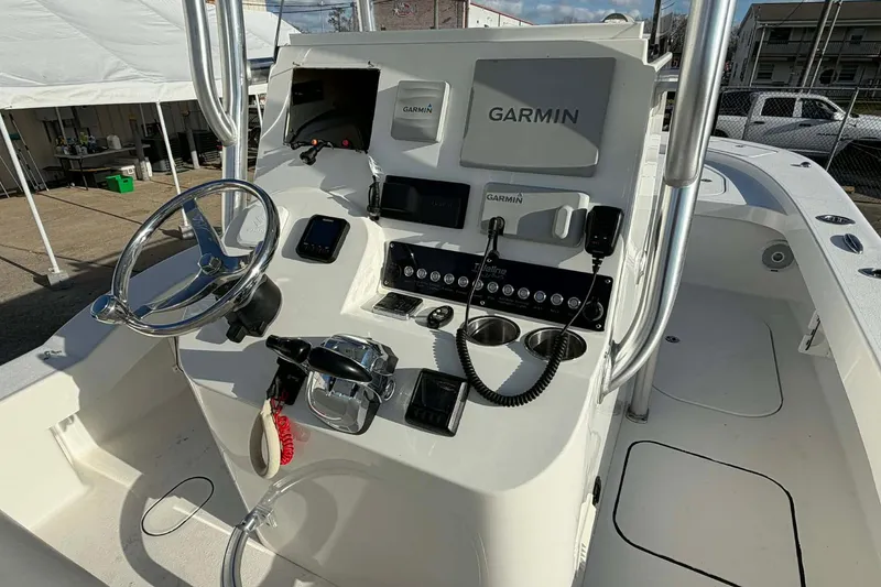 Slide: The Image of 2020 Tideline 235 Hybrid boat console with Garmin electronics and steering wheel. - 13
