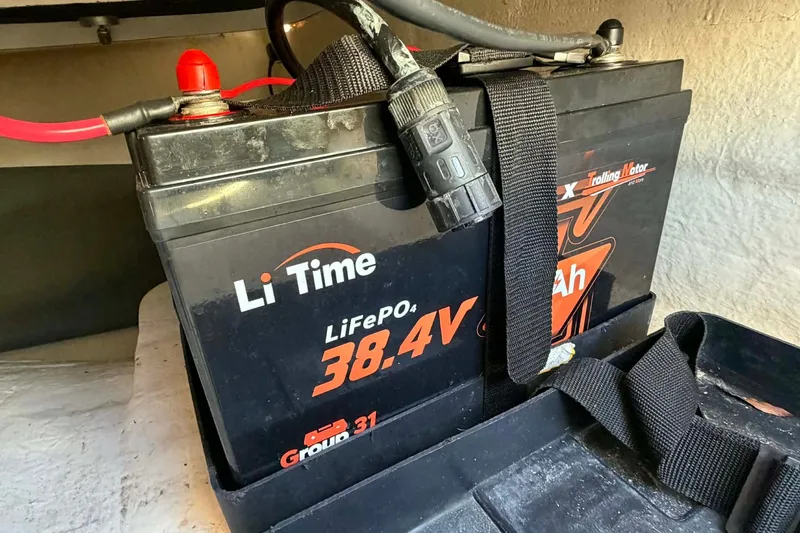 Slide: The Image of Battery in a 2020 Tideline 235 Hybrid, LiFePO4, 38.4V, Group 31, secured with strap. - 15