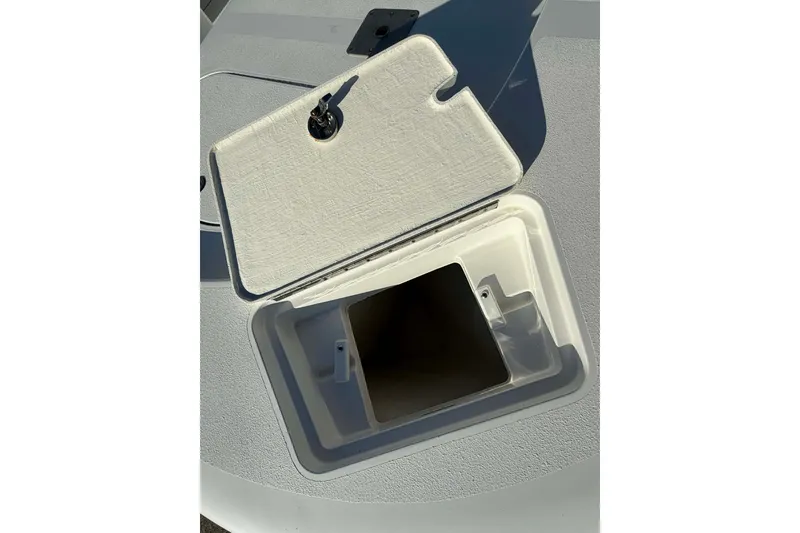 Slide: The Image of Open storage compartment on 2020 Tideline 235 Hybrid boat deck. - 17