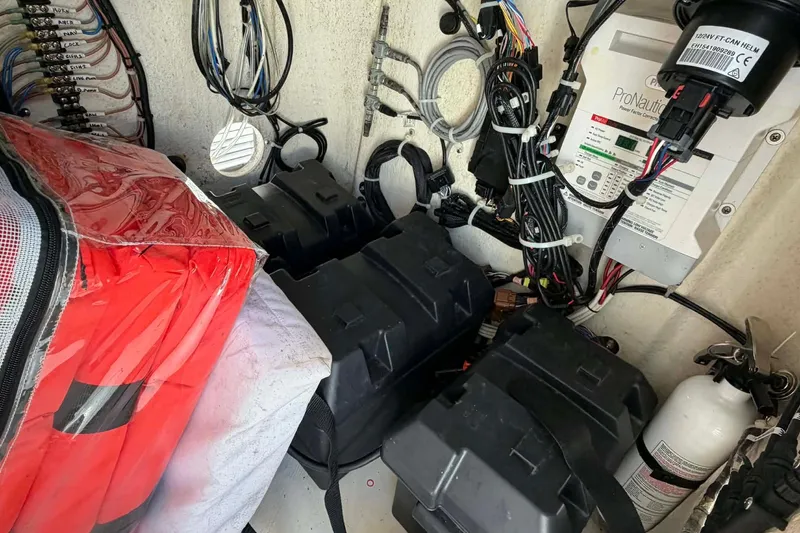 Slide: The Image of Electrical system and safety equipment inside a 2020 Tideline 235 Hybrid boat. - 23