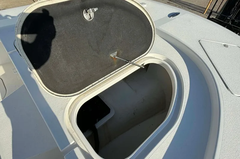 Slide: The Image of Open storage compartment on 2020 Tideline 235 Hybrid boat deck. - 24