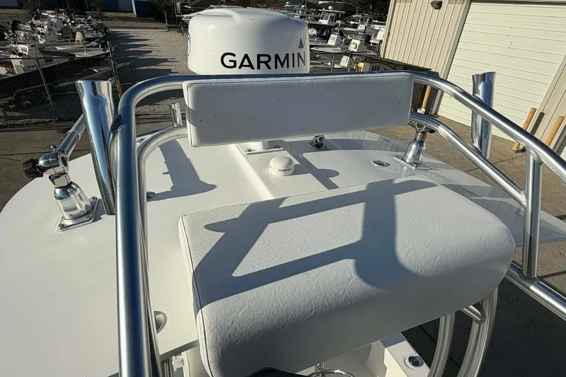 Slide: The Image of 2020 Tideline 235 Hybrid boat with Garmin equipment, featuring sleek metal railings. - 25
