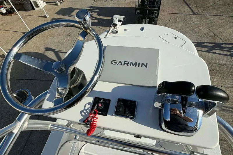 Slide: The Image of 2020 Tideline 235 Hybrid boat helm with Garmin navigation and dual throttle controls. - 3