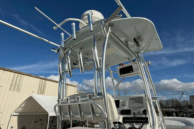 Slide: The Image of 2020 Tideline 235 Hybrid boat with advanced navigation equipment under a clear blue sky. - 7