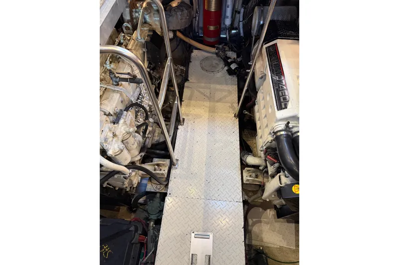 Slide: The Image of Engine room of 2001 Cruisers 4450 ACMY yacht with visible machinery and equipment. - 28