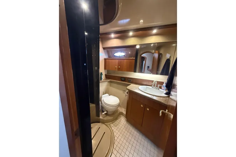 Slide: The Image of Luxurious bathroom in 2001 Cruisers 4450 ACMY yacht with modern amenities. - 24