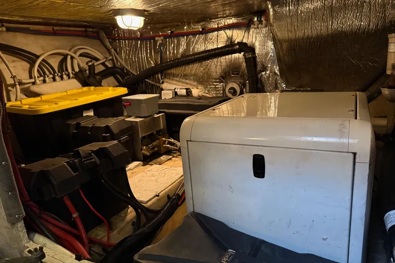 Slide: The Image of Engine room of 2001 Cruisers 4450 ACMY yacht with equipment and wiring. - 29