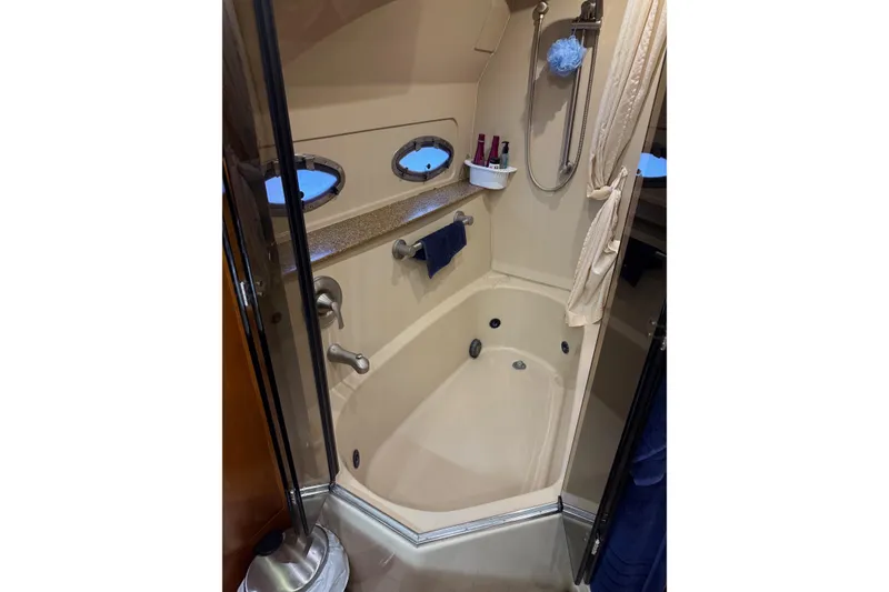 Slide: The Image of Bathroom interior of 2001 Cruisers 4450 ACMY yacht with shower and portholes. - 20