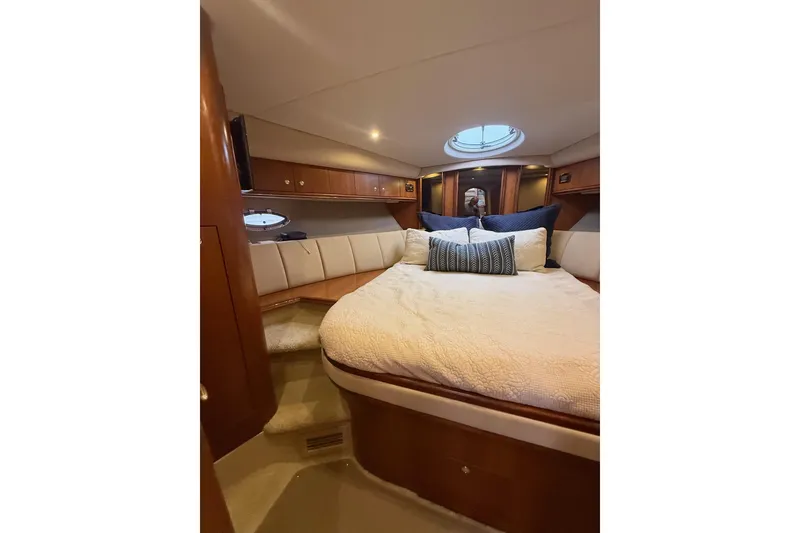 Slide: The Image of Luxurious cabin interior of 2001 Cruisers 4450 ACMY yacht with cozy bedding. - 23