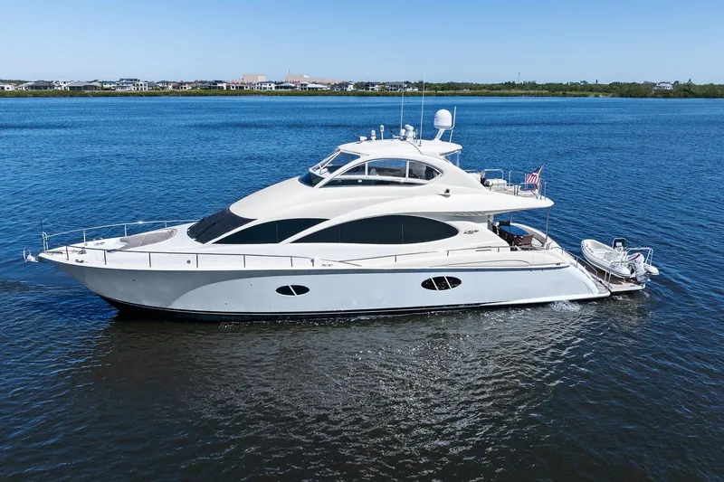 The Image of Luxurious Lazzara yacht cruising on calm blue waters under a clear sky. - 0