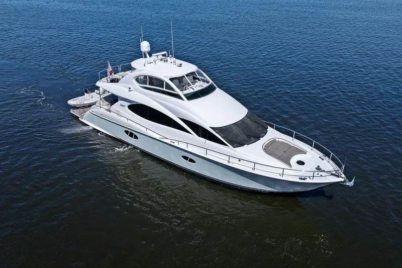 Slide: The Image of Luxurious Lazzara yacht cruising on open water, showcasing sleek design and elegance. - 1