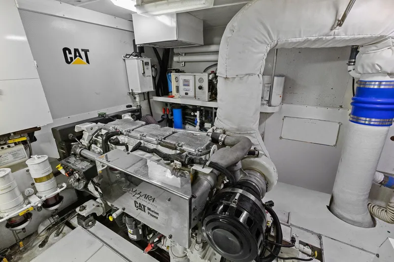 Slide: The Image of Engine room of a Lazzara yacht featuring a CAT marine power engine. - 100