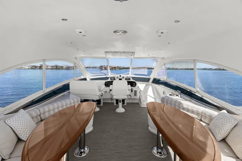 Slide: The Image of Luxurious Lazzara yacht interior with panoramic windows, elegant seating, and polished wooden tables. - 31