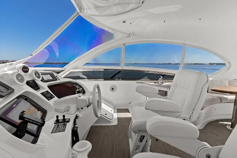 Slide: The Image of Luxurious Lazzara yacht cockpit with white leather seating and panoramic ocean view. - 37