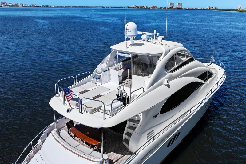 Slide: The Image of Luxurious Lazzara yacht cruising on calm blue waters, featuring sleek design and spacious deck. - 4