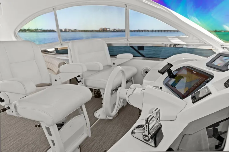 Slide: The Image of Luxurious Lazzara yacht helm with white leather seats and advanced navigation system. - 40
