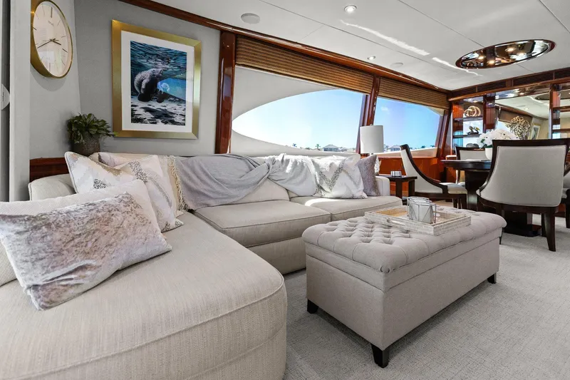 Slide: The Image of Luxurious Lazzara yacht interior with elegant seating, artwork, and dining area. - 43