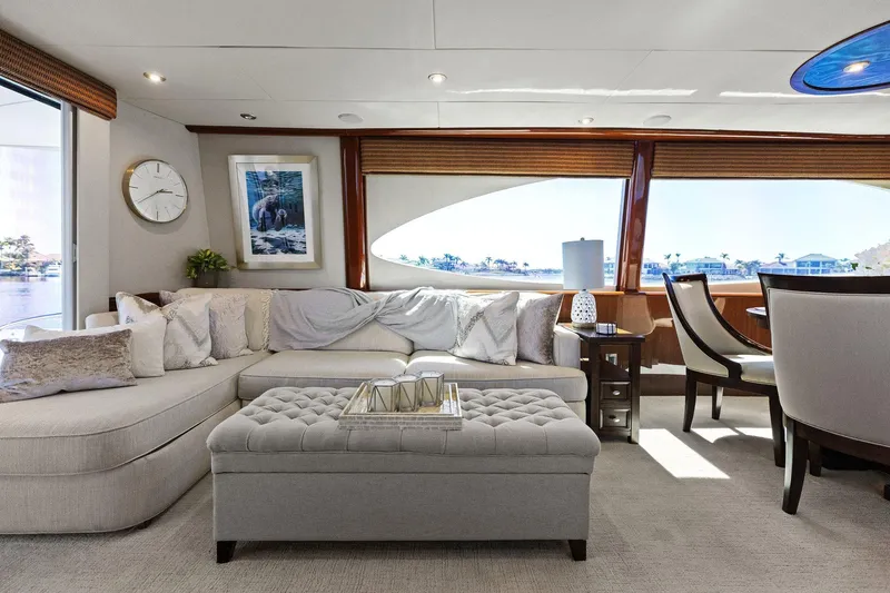 Slide: The Image of Luxurious Lazzara yacht interior with elegant seating, large windows, and stylish decor. - 44